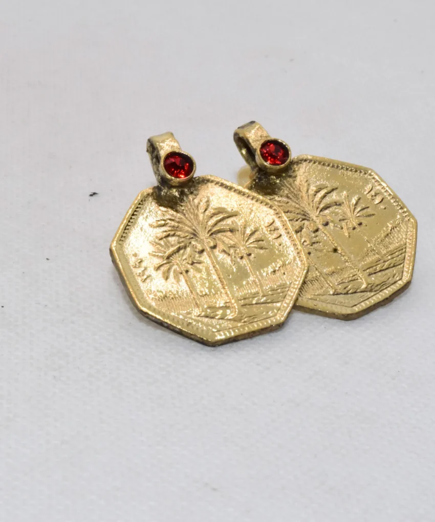 Our Arabic Gold Coin Earrings are a unique and sophisticated cultural statement, showcasing the rich heritage of the Iran Islamic State through a meticulously crafted gold coin design featuring a date palm tree.