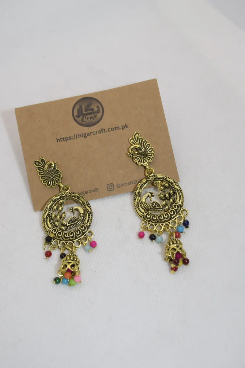 Discover our exquisite Ladies Artificial Earrings, featuring intricate peacock motifs and ornate designs. Elevate your style with these captivating accessories today!