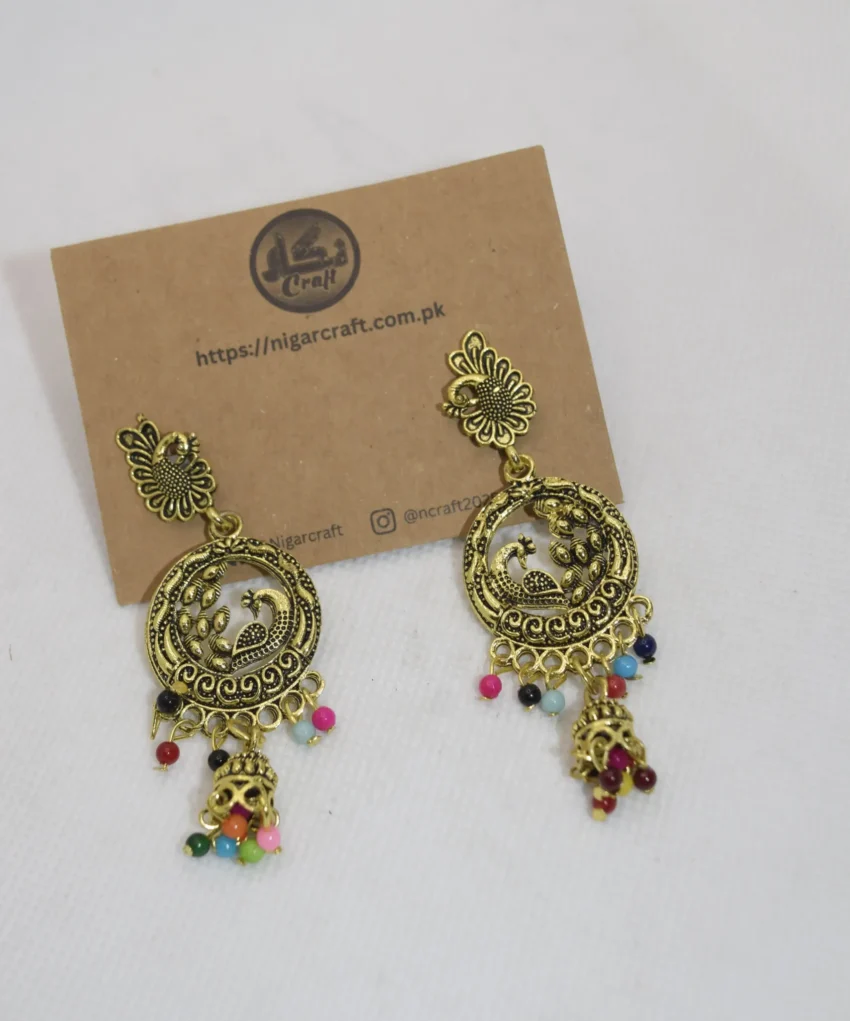 Discover our exquisite Ladies Artificial Earrings, featuring intricate peacock motifs and ornate designs. Elevate your style with these captivating accessories today!