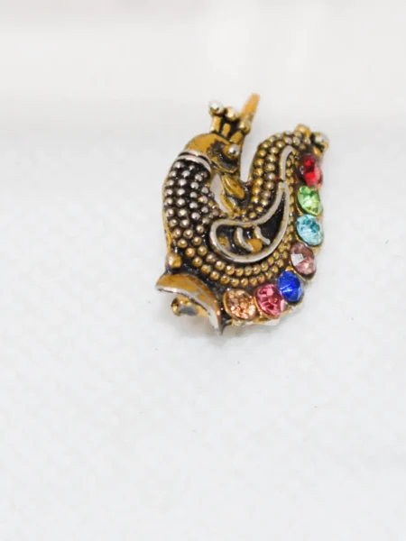 Explore the exquisite Peacock Nose Cuff Jewelry, featuring intricate designs and stunning details. Elevate your style with this unique, handcrafted accessory.