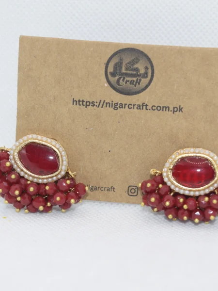 Elevate your style with our Red Kundan Earrings, showcasing intricate designs and vibrant gemstones. Experience classic elegance that complements any outfit.