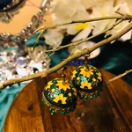 Unveil the charm of Golden Small Jhumki, a perfect fusion of nature and artistry. Delicate details and a unique display create a captivating visual experience.