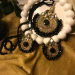 Explore charm of Simple Artificial Jewellery Sets,highlights the stunning contrast of faceted black beads, gold filigree pendants, & matching earrings set