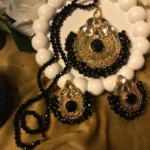 Explore charm of Simple Artificial Jewellery Sets,highlights the stunning contrast of faceted black beads, gold filigree pendants, & matching earrings set