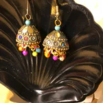 Discover the breathtaking evolution of Gold Jhumki designs, where ancient tradition meets vibrant, modern artistry.