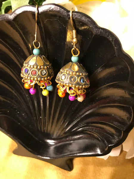 Discover the breathtaking evolution of Gold Jhumki designs, where ancient tradition meets vibrant, modern artistry.