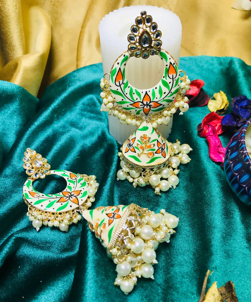 Elevate your style with our exquisite White Kundan Jhumka earrings. Ideal for festive celebrations, these pieces blend tradition with modern elegance.